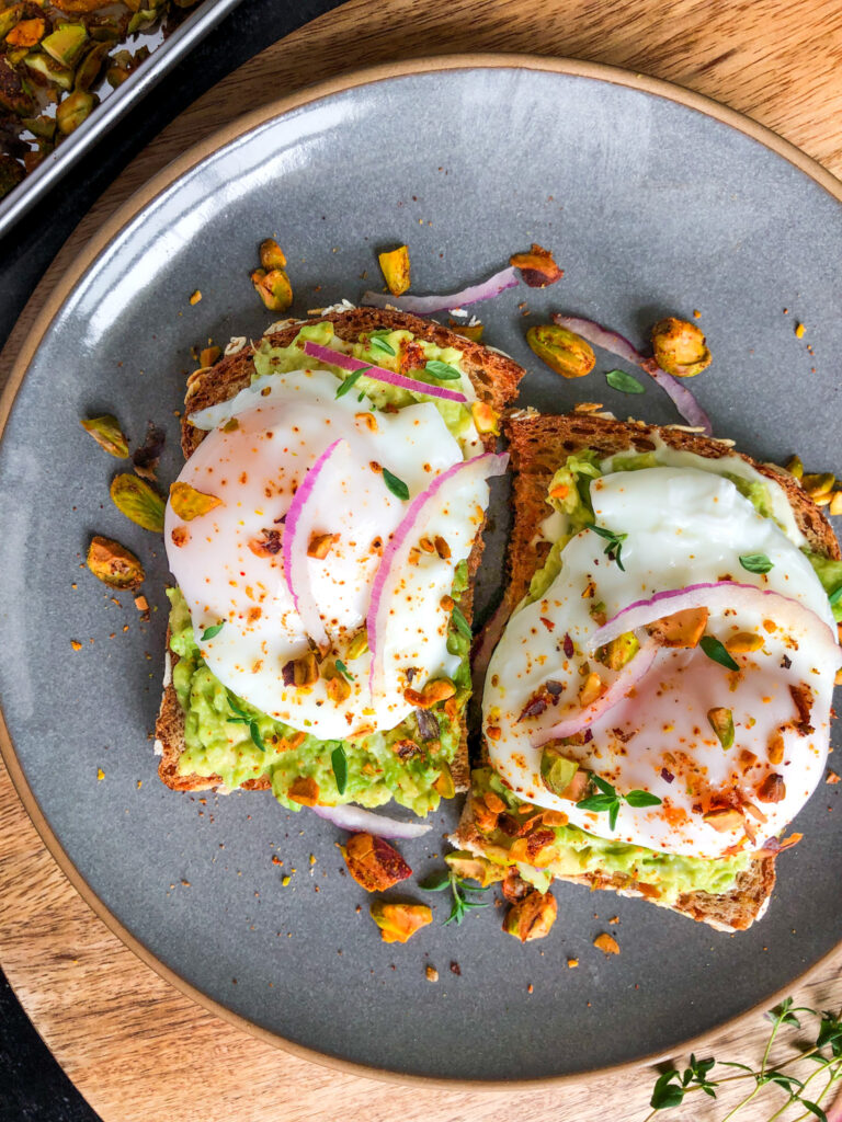 Avocado toast with lemon dill aioli and crushed pistachios