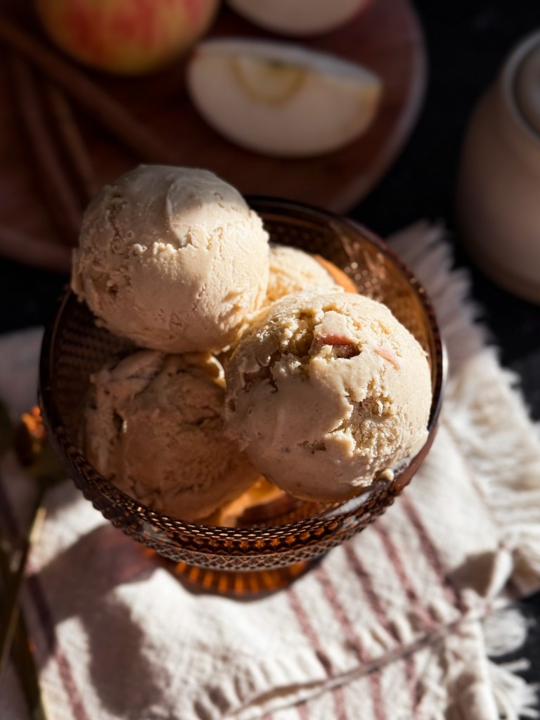 Maple Cinnamon Apple Ice Cream with moody sunlight coming through a window 