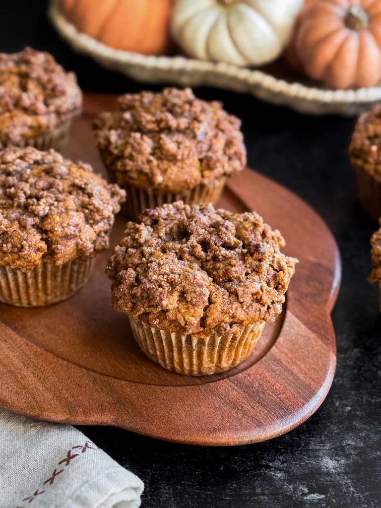 Side view of the BEST Pumpkin Streusel Muffins, showing the delicious crumble streusel topping.