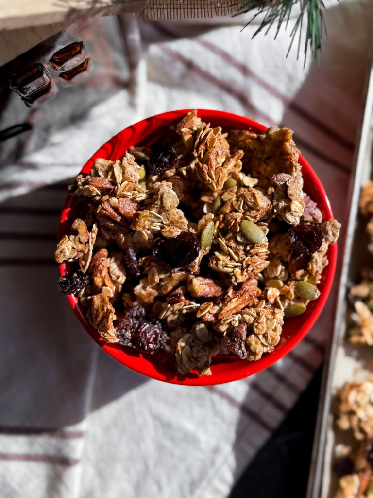 An easy Christmas Granola recipe in a cute red bowl.
