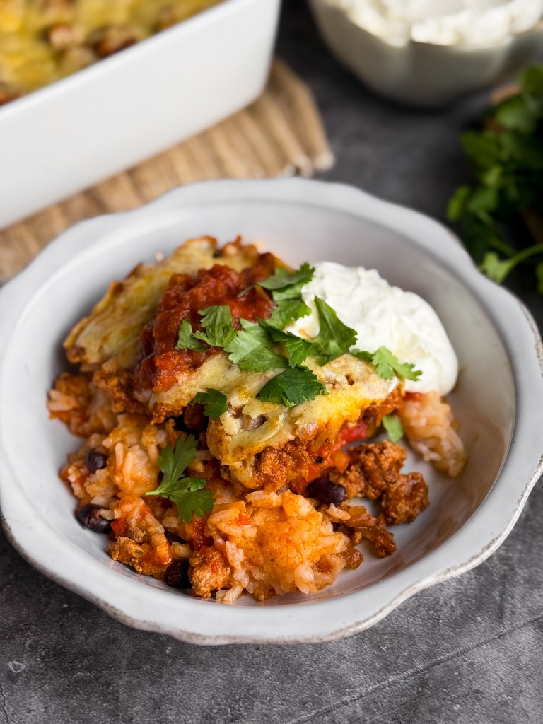 Healthy Taco Casserole with salsa, cilantro, and sour cream