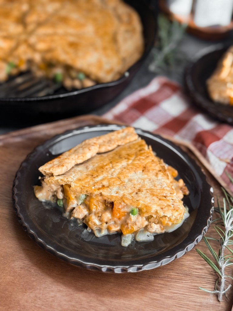 A big slice of The Easiest Chicken Pot Pie (One-Pan!) by home-cooked living