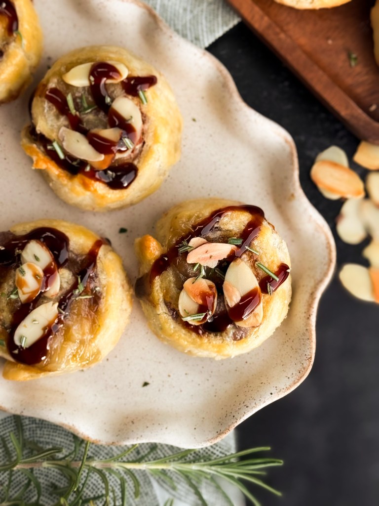 Fortunata Pastries by home-cooked living - a combination of brie, rosemary, and jam wrapped up in pie crust for a pastry pinwheel baked in the oven.