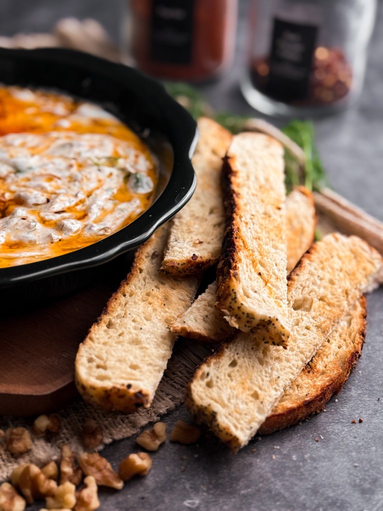 Toasted sourdough slices for zesty greek yogurt dip