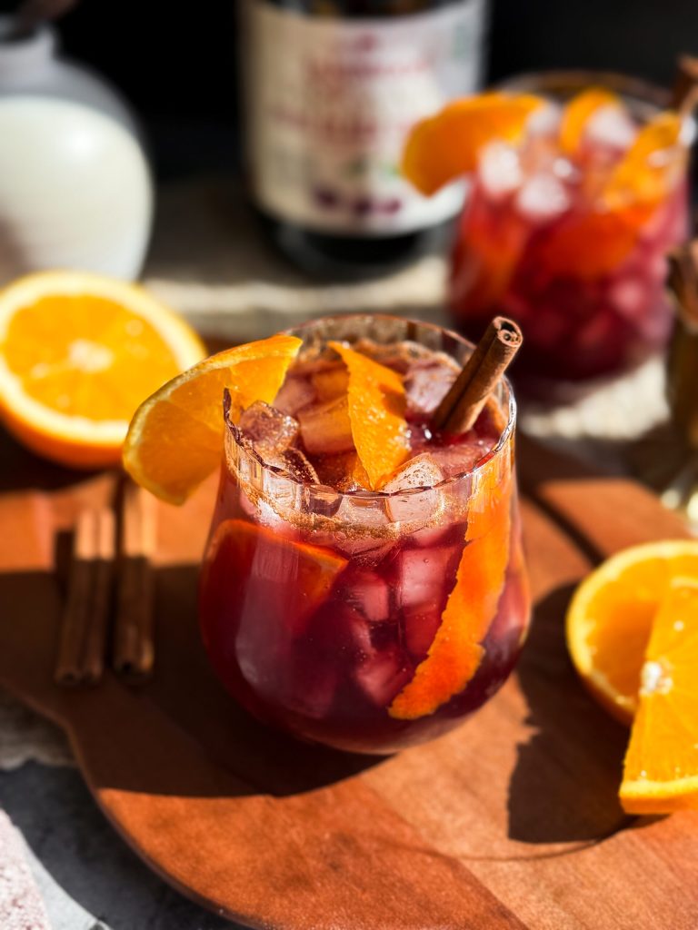 Spiced Cherry Orange Mocktail with black cherry juice, fresh orange, and ceylon cinnamon 