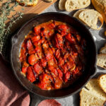 The easiest appetizer ever! Blistered tomatoes with toasted garlic, fresh thyme or basil, and a balsamic glaze goes perfectly with toasted sourdough, baguette, or crackers.