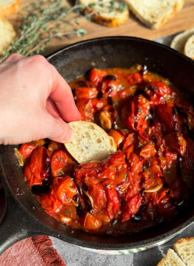 The easiest appetizer ever! Blistered tomatoes with toasted garlic, fresh thyme or basil, and a balsamic glaze goes perfectly with toasted sourdough, baguette, or crackers.