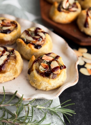 Healthy pastry recipe by home-cooked living. Filled with brie, rosemary, and jam, and topped with toasted almonds and balsamic glaze.