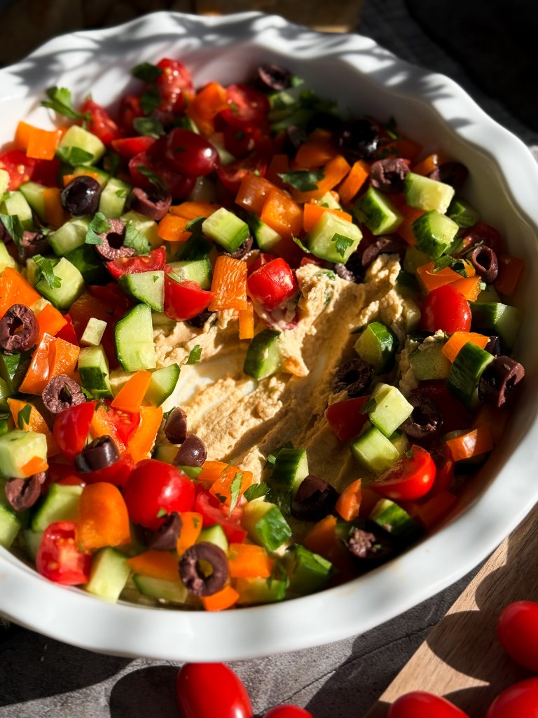 Everyone loves an easy, healthy, and delicious appetizer like this Loaded Hummus by Home-Cooked Living!