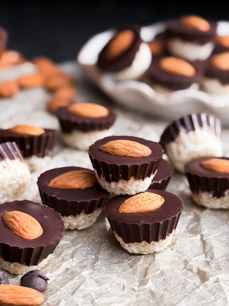 Healthy Almond Joy Cups stacked on top of each other